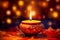 Festive calmly burning candle in oriental style with flower petals on dark blue background with bokeh. Concept esoteric