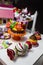 Festive children`s table with a beautiful bear cake flowers and colorful cookies. CandyBar. Children`s Day Births