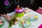 Festive children`s table with a beautiful bear cake flowers and colorful cookies. CandyBar. Children`s Day Births