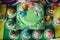 Festive children`s table with a beautiful cake decorated with green and multi-colored biscuits. candy. Children`s birthday.Cake