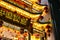 Festive Chinese food stand adorned with Christmas decorations in bustling shops