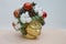 Festive Christmas accessories - red balls, fir cones and cotton on a stylized golden female head. Interior Christmas composition