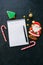 Festive Christmas background, white page of notepad with inscription \