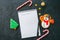 Festive Christmas background, white page of notepad with inscription \