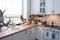 Festive Christmas decor and mess in the light kitchen, festive breakfast, white scandi interior. New Year, mood, cozy home