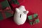 Festive Christmas financial savings concept. White piggy bank money box with presents