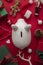 Festive Christmas financial savings concept. White piggy bank money box with presents and decorations