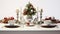 a festive Christmas table setting arranged on a white wooden table, featuring elegant dinnerware, holiday decorations