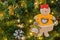 A festive Christmas wonderful toys in the form of gingerbread isolated on christmas tree background, Christmas tree ornament