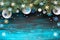 Festive Christmasr background with fir twigs, blue, yellow and white paper decorations, copy-space