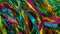 Festive colorful background where long multi-colored ribbons flutter in the wind