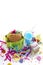 Festive composition drinks snacks holiday hamburger cookie tinsel confetti gift box cocktail saturated colors.