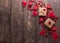 Festive composition. Hearts from red felt, boxes handmade on a wooden table