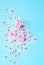 Festive concept from rosebuds on blue background. Valentines Day or Flowers in Motion