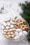 Festive cookies assorted vanilla crescents, cinnamon stars, gingerbreads and cubes and stollen on a festive background.