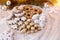 Festive cookies assorted vanilla crescents, cinnamon stars, gingerbreads and cubes and stollen on a festive background.