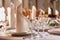 festive covered table with cutlery, beautiful glasses and a napkin in restaurant.