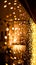 Festive dark blurred background with bokeh lights, garland and house