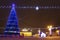 Festive decorated Christmas tree on square in winter Minsk. Celebration New Year and Xmas in night Minsk