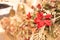 Festive decoration background with red artificial poinsettia flowers as Christmas symbol