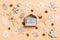 Festive decorations and toys on orange background. Top view of wooden calendar. The first of January. Happy New Year concept