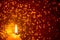Festive decorative background with glowing candle and many sparks