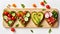 Festive delicious bread toasts with various vegetables, heart-shaped, on a wooden board