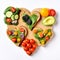 Festive delicious toasts with vegetables, heart-shaped, on white background