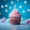 Festive delight Birthday cupcake with pink cream on blue background