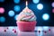 Festive delight Birthday cupcake with pink cream on blue background