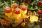 Festive dessert pudding in glasses with candles and decorations on table