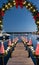 A Festive Dock With Boats Adorned With Lights And Wreaths. Generative AI