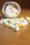 Festive Easter multicolor jelly jeans in and out of jar on wood table