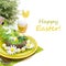 Festive Easter table setting with decorations, egg and flowers