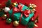 festive environment with Christmas gifts and decorations on a red background