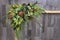 Festive flower arrangement on a gray wooden background. Artificial flowers.