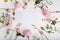 Festive flower composition on the white wooden background. Overhead view