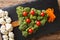 Festive food: a healthy Christmas tree of fresh broccoli, cauliflower, tomatoes, pepper closeup. Horizontal top view