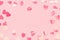 Festive frame of hearts Confetti on pink pastel holiday background