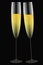 Festive glasses of champagne in gold and black collors