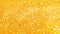 Festive gold glitter background.Christmas yellow background. sparkling texture. Golden shimmering light.