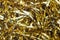 Festive gold tinsel strands. Glistening web banner or background for your design