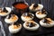 Festive Halloween appetizer: halved devil`s eggs decorated with