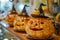 Festive Halloween Pumpkin Decorations with Witch Hats on Display in Seasonal Store