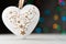 Festive heart shaped decoration ornament with colorful bokeh lights