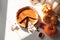 Festive homemade appetizing ripe pumpkin pie, pumpkin tart decorated with nuts, minimalistic light background
