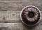 Festive homemade cakes. Round chocolate muffin, large biscuit or cake with chocolate icing on an ancient wooden background. Place