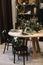 Festive kitchen in Christmas decorations. Christmas dining room. Beautiful New Year decorated classic home interior.