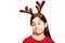 Festive little girl wearing antlers