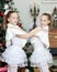 Festive little girls hugging.